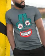 Tshirt Creepy Smile and Eyes, Funky Horror Art - model in grey shirt leaning against column