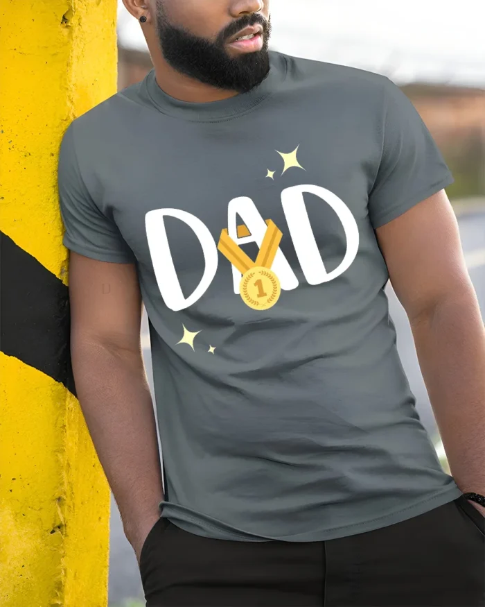 Top Dad T-Shirt World’s Greatest Father - model in grey shirt leaning against column