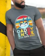 Daddy Shark Doo Fun Father Shark Shirt Now - model in grey shirt leaning against column