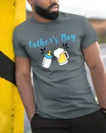 First Father’s Day Baby Bottle Beer Dad Shirt - model in grey shirt leaning against column