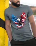 American Eagle Wings Patriotic USA Flag T-Shirt - model in grey shirt leaning against column