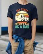 First Father’s Day Fist Bump Tee New Dad T-Shirt for Proud Fathers - model wearing navy shirt, hands in pockets