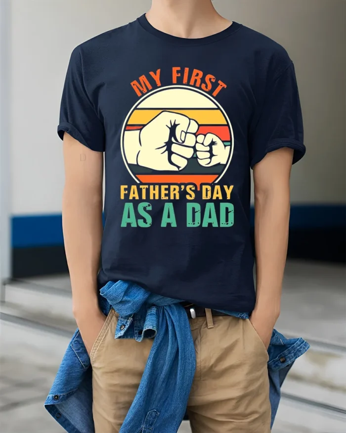 First Father’s Day Fist Bump Tee New Dad T-Shirt for Proud Fathers - model wearing navy shirt, hands in pockets