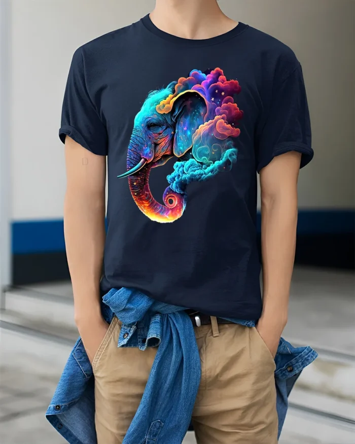 Cosmic Elephant T-Shirt Vibrant Animal Graphic Tee with Dreamy Galaxy Clouds - model wearing navy shirt, hands in pockets