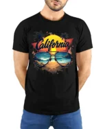 California Beach Vibes Tee Retro Sunset Sunglasses T-Shirt for West Coast Fans - model wearing black shirt, hands behind back