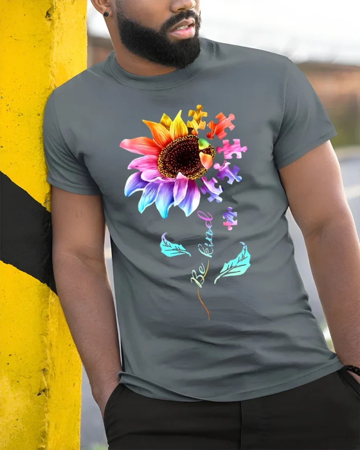 Be Kind Puzzle Sunflower T-Shirt Autism Awareness Graphic Tee for Kindness - model in grey shirt leaning against column
