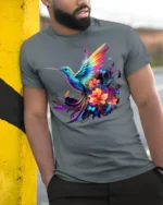 Rainbow Hummingbird Tee Vibrant Floral Butterfly T-Shirt for Nature Lovers - model in grey shirt leaning against column