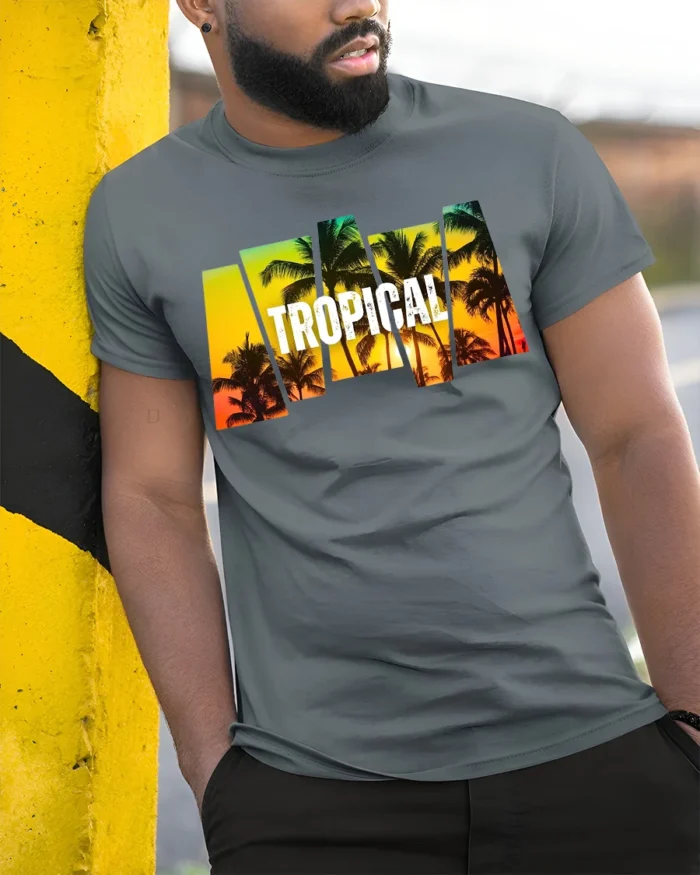 Tropical Sunset Palm Tree T-Shirt Island Vacation Beach Tee for Summer Vibes - model in grey shirt leaning against column