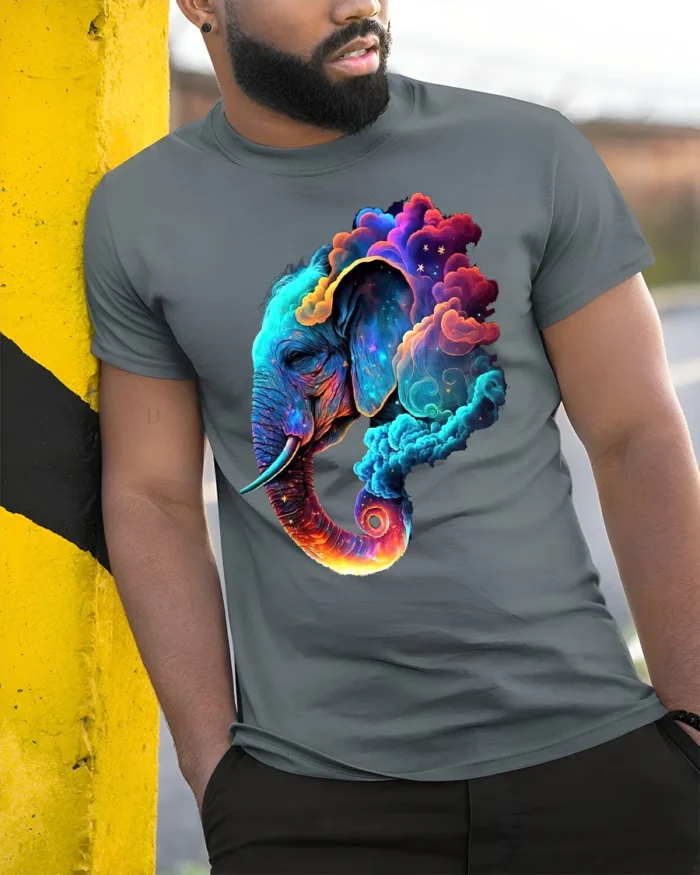 Cosmic Elephant T-Shirt Vibrant Animal Graphic Tee with Dreamy Galaxy Clouds - model in grey shirt leaning against column