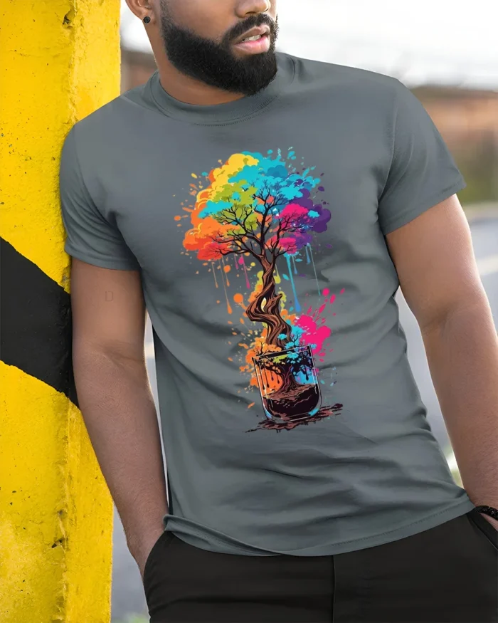 Rainbow Bonsai in a Glass T-Shirt  Artistic Nature Tee for Creative Souls - model in grey shirt leaning against column