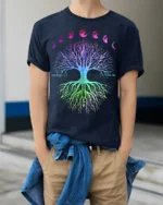 Celestial Chakra Tree - Gradient Moon Phases Tree of Life Yoga Zen T-Shirt - model wearing navy shirt, hands in pockets