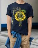 Sunflower Guitar T-Shirt Floral Musical Notes Tee for Music and Nature Lovers - model wearing navy shirt, hands in pockets