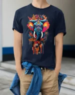 Colorful Elephant T-Shirt Tribal Wildlife Art Tee for Nature and Culture Lovers - model wearing navy shirt, hands in pockets