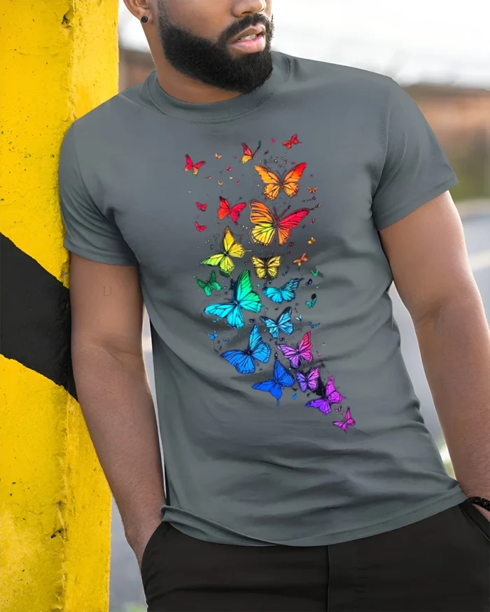 Rainbow Wings Colorful Flying Butterflies T-Shirt for Nature Fans - model in grey shirt leaning against column