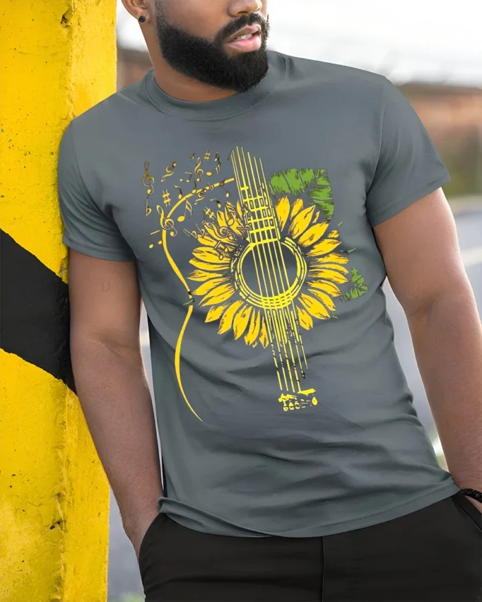 Sunflower Guitar T-Shirt Floral Musical Notes Tee for Music and Nature Lovers - model in grey shirt leaning against column