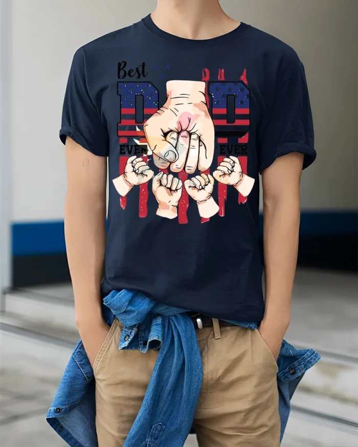 Father’s Day T-Shirt Best Dad Ever Fist Bump Tee with American Flag Design - model wearing navy shirt, hands in pockets