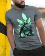 Spirit Turtle T-Shirt Magical Forest Creature Tee with Neon Green Design - model in grey shirt leaning against column
