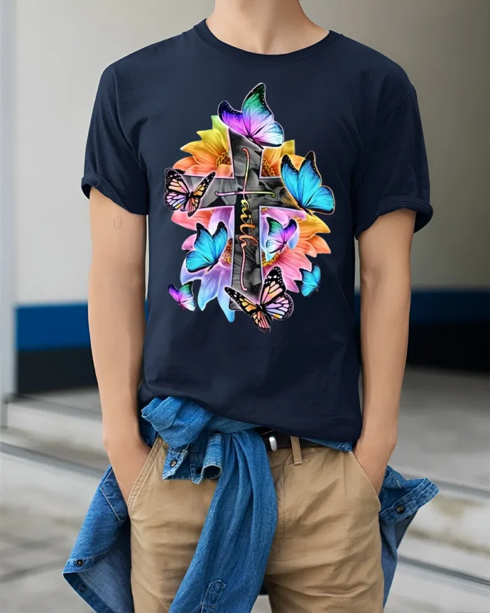 Christian Faith T-Shirt with Cross, Flowers, and Butterflies - model wearing navy shirt, hands in pockets
