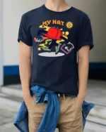 Funky Hat Graphic T-Shirt Playful Hip Hop Style Tee - model wearing navy shirt, hands in pockets