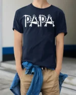 Papa Fix-It T-Shirt Tools Design Gift for Handy Dads - model wearing navy shirt, hands in pockets