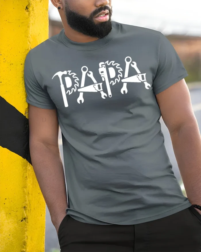 Papa Fix-It T-Shirt Tools Design Gift for Handy Dads - model in grey shirt leaning against column