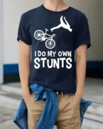 I Do My Own Stunts T-Shirt Funny Bike Fall Graphic Tee - model wearing navy shirt, hands in pockets