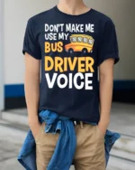 Don’t Make Me Use My Bus Driver Voice T-Shirt for Adults - model wearing navy shirt, hands in pockets