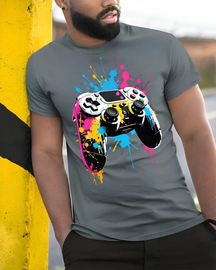 Vibrant Gamer T-Shirt with Splatter Art Controller Print - model in grey shirt leaning against column