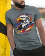 Patriotic Eagle T-Shirt with USA Flag Splash Graphic - model in grey shirt leaning against column