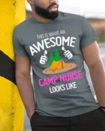 Awesome Camp Nurse T-Shirt Funny Outdoor Camping Tee - model in grey shirt leaning against column