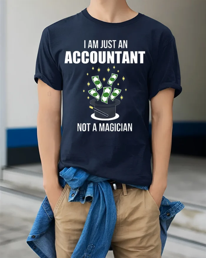 Funny Accountant T-Shirt Not a Magician Finance Tee - model wearing navy shirt, hands in pockets