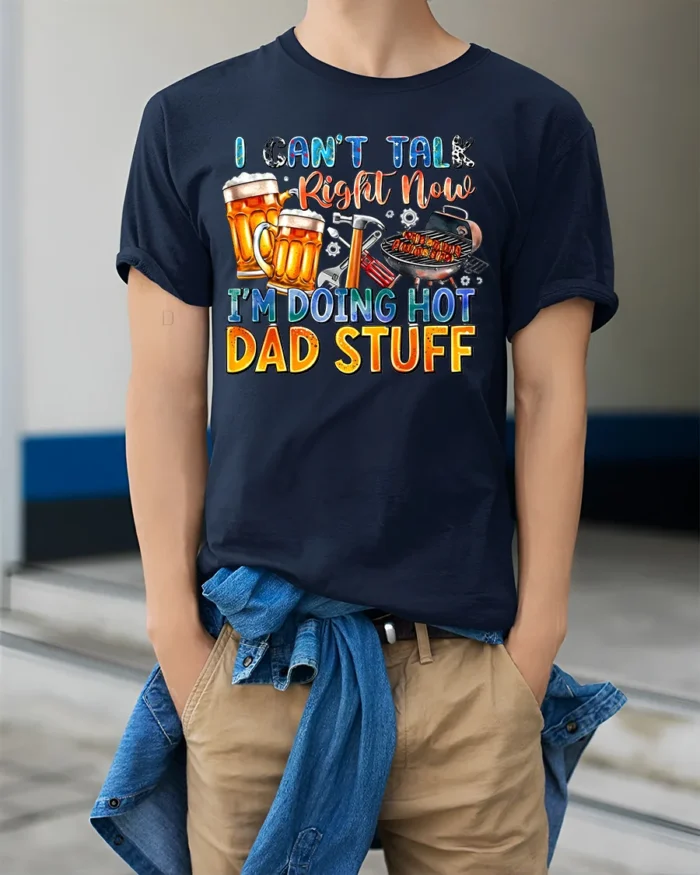 Funny Dad T-Shirt Hot Dad Stuff BBQ Beer Grill Tee USA - model wearing navy shirt, hands in pockets