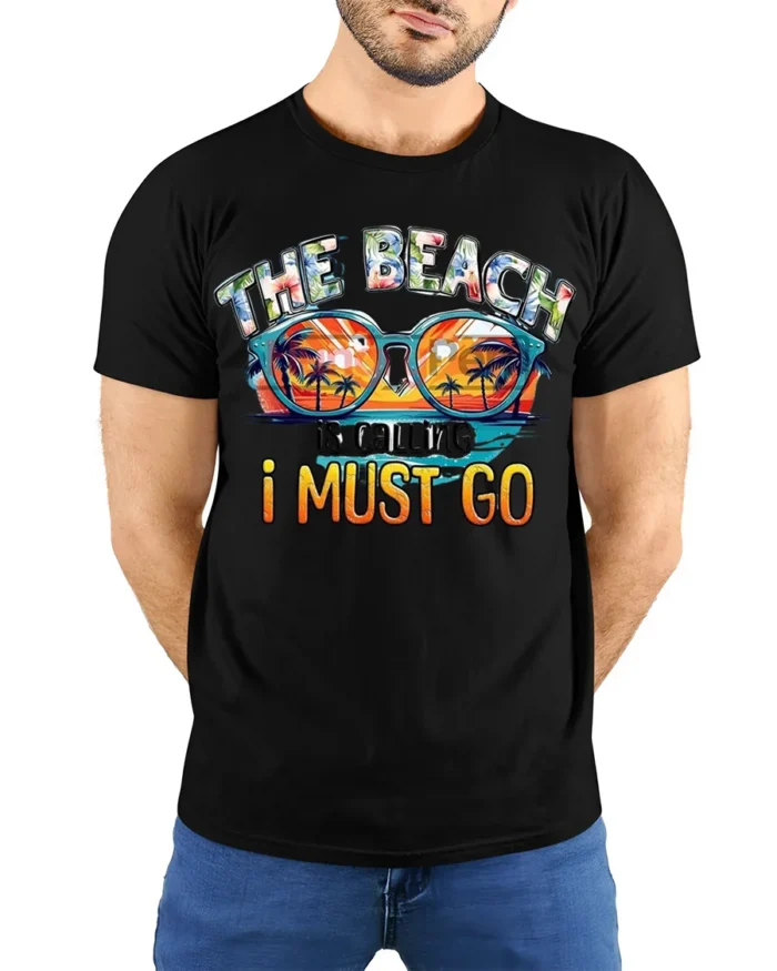 The Beach Is Calling T-Shirt Retro Summer Vacation Tee - model wearing black shirt, hands behind back