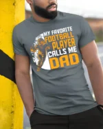 My Favorite Football Player Calls Me Dad T-Shirt Gift - model in grey shirt leaning against column