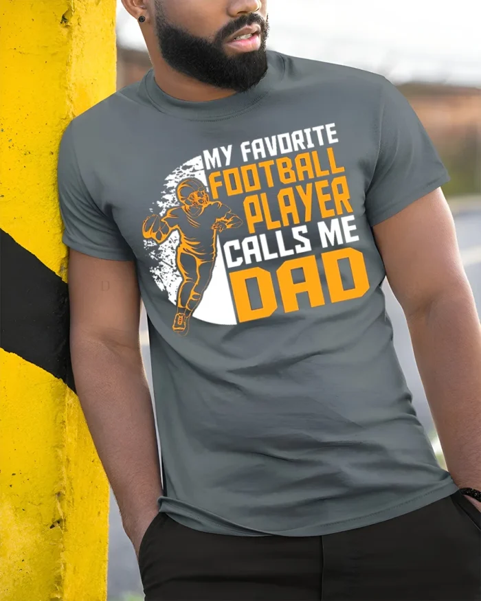 My Favorite Football Player Calls Me Dad T-Shirt Gift - model in grey shirt leaning against column
