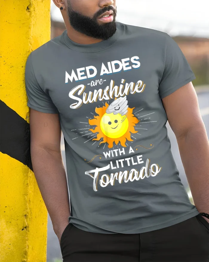 Funny Med Aides T-Shirt Sunshine and Tornado Design Tee - model in grey shirt leaning against column