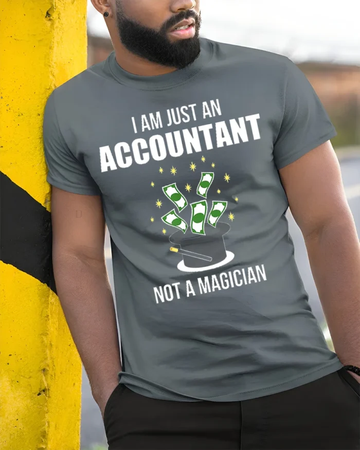 Funny Accountant T-Shirt Not a Magician Finance Tee - model in grey shirt leaning against column