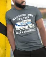 Never Underestimate Old Man Motorhome T-Shirt Funny Tee - model in grey shirt leaning against column