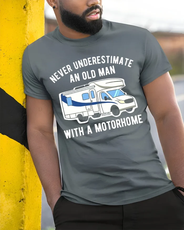Never Underestimate Old Man Motorhome T-Shirt Funny Tee - model in grey shirt leaning against column
