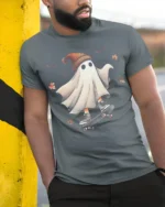 Funny Skater Ghost Halloween T-Shirt Cool Fall Vibes - model in grey shirt leaning against column