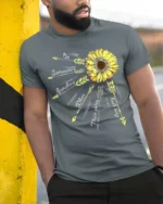 Sunshine Quote T-Shirt with Arrows and Sunflower Art - model in grey shirt leaning against column