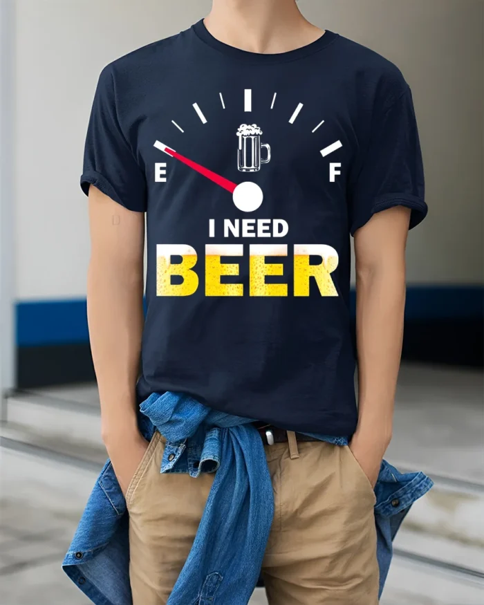 I Need Beer Funny T-Shirt Low Fuel Gauge Beer Lovers - model wearing navy shirt, hands in pockets