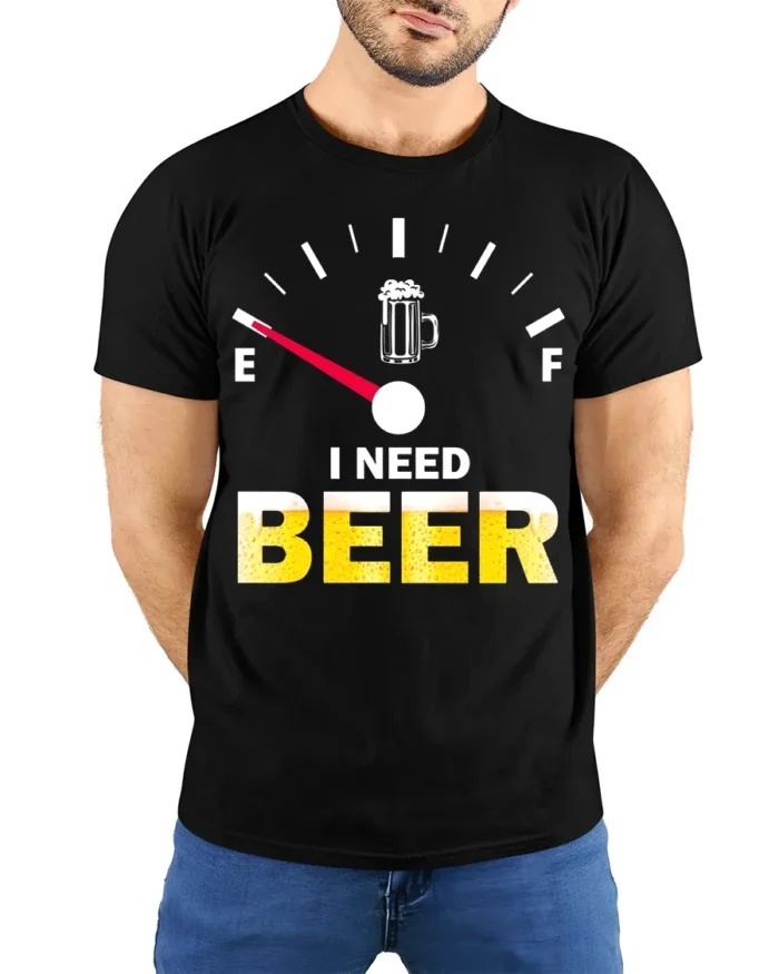 I Need Beer Funny T-Shirt Low Fuel Gauge Beer Lovers - model wearing black shirt, hands behind back