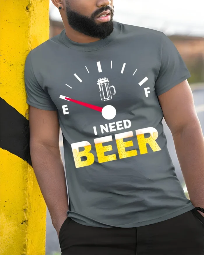 I Need Beer Funny T-Shirt Low Fuel Gauge Beer Lovers - model in grey shirt leaning against column