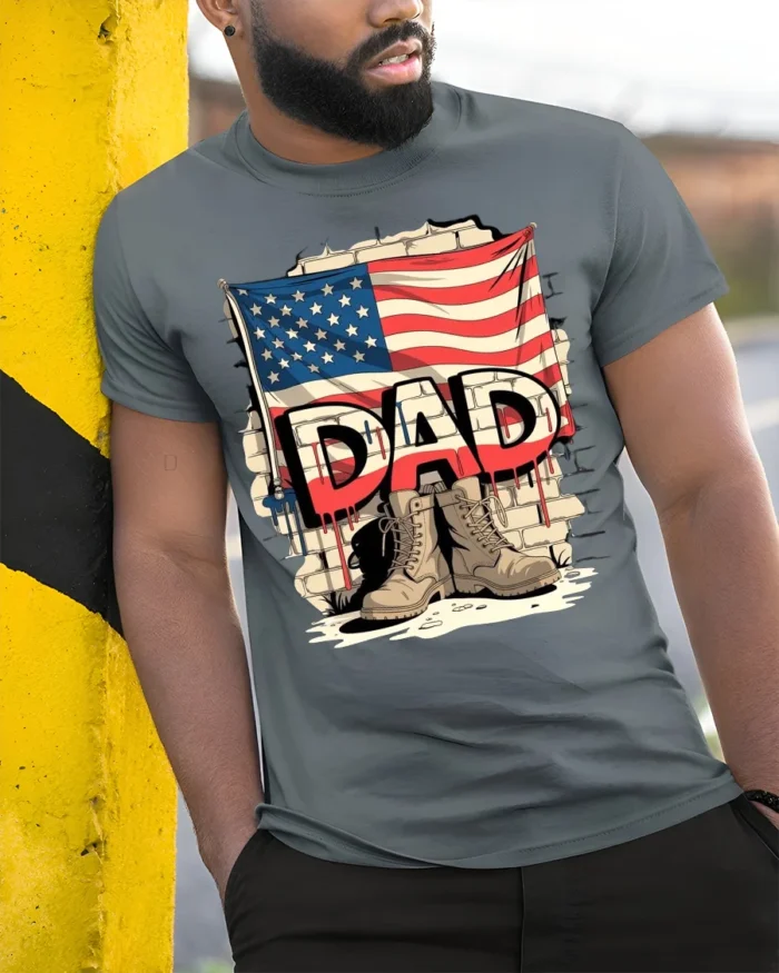 USA Flag Dad T-Shirt with Combat Boots Veteran Tribute - model in grey shirt leaning against column
