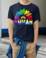 Colorful Human Rights T-Shirt Pride Flower Graphic - model wearing navy shirt, hands in pockets
