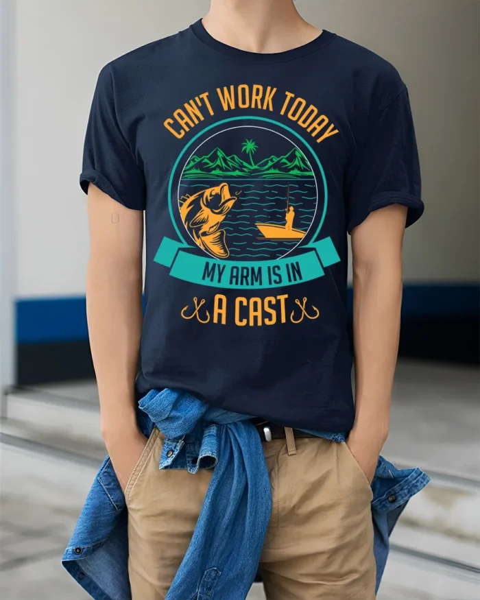Funny Fishing T-Shirt My Arm Is in a Cast Graphic - model wearing navy shirt, hands in pockets