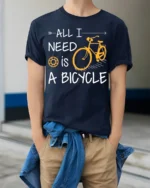 All I Need Is A Bicycle T-Shirt Casual Bike Rider - model wearing navy shirt, hands in pockets
