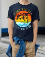 Keep The Sea Plastic Free Dolphin T-Shirt Eco Graphic - model wearing navy shirt, hands in pockets