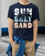 Sun Salt Sand T-Shirt Retro Summer Beach Vibe Tee - model wearing navy shirt, hands in pockets